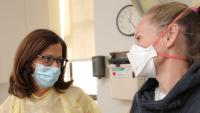Emily DiMango, MD, meets with a patient in the Adult CF Program.